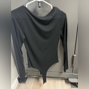 Black long sleeve bodysuit thong bottom.